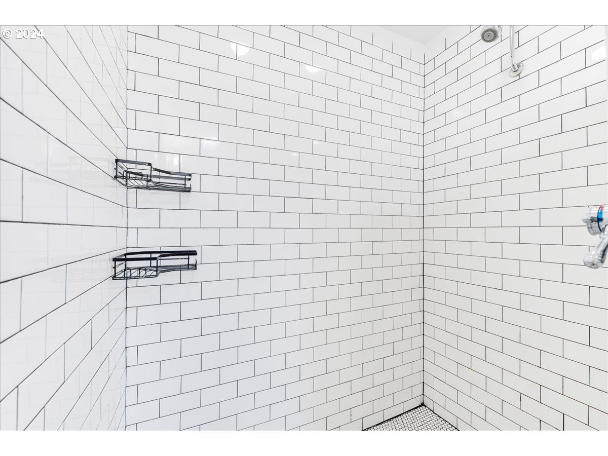 2675 Southwest Spring Garden Street Portland, OR 97219 - Photo 25 of 31 a bathroom with a shower