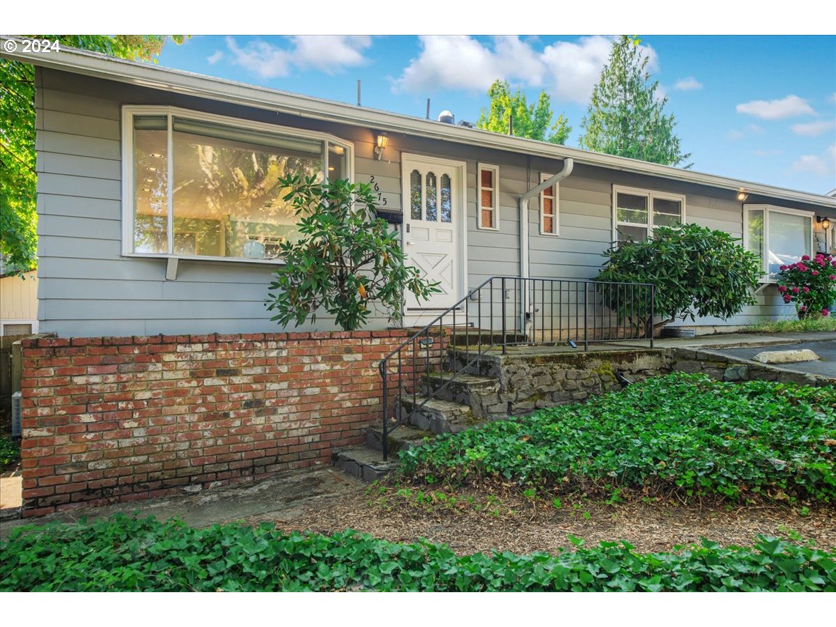 2675 Southwest Spring Garden Street Portland, OR 97219 - Photo 4 of 31 a view of house with backyard