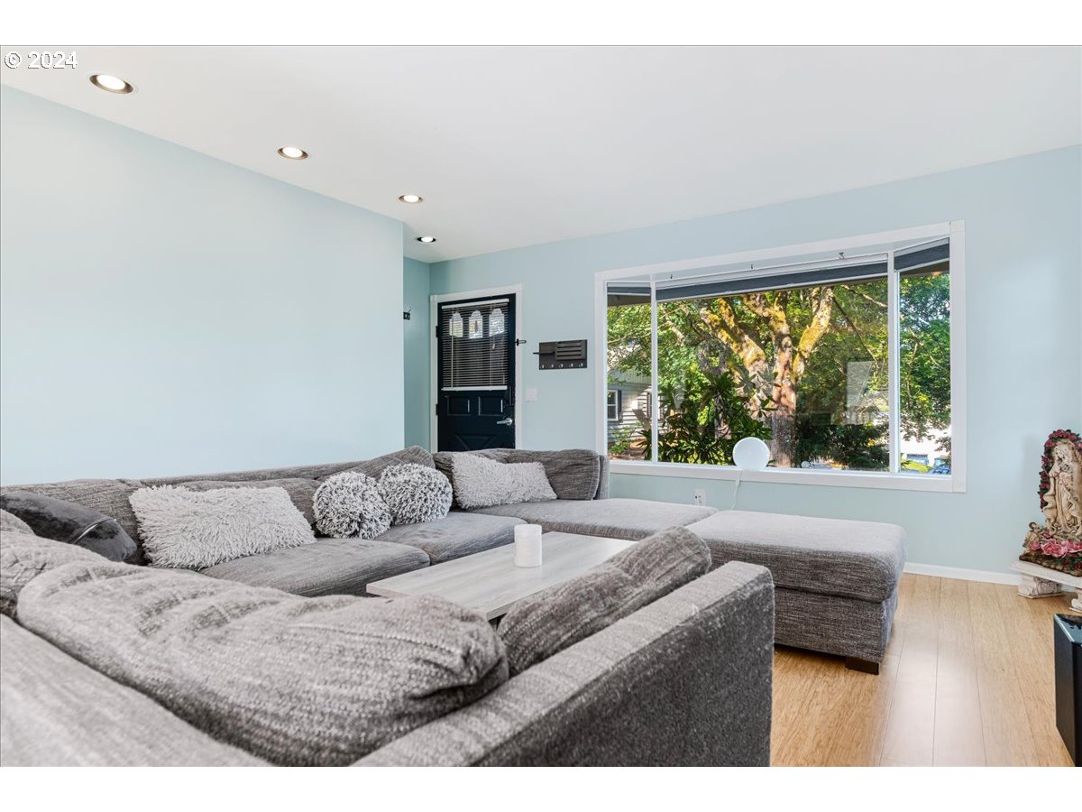 2675 Southwest Spring Garden Street Portland, OR 97219 - Photo 7 of 31 a living room with furniture and a large window