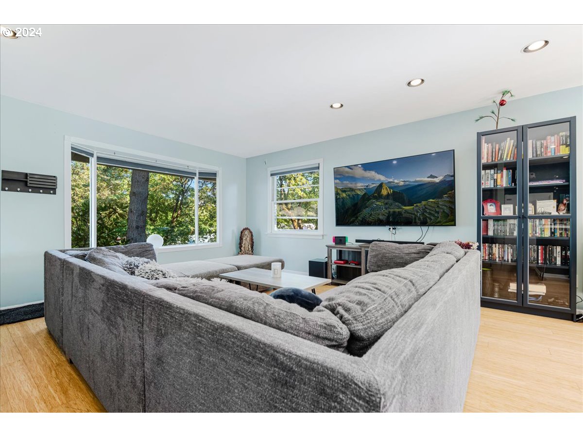 2675 Southwest Spring Garden Street Portland, OR 97219 - Photo 8 of 31 a living room with furniture and a flat screen tv