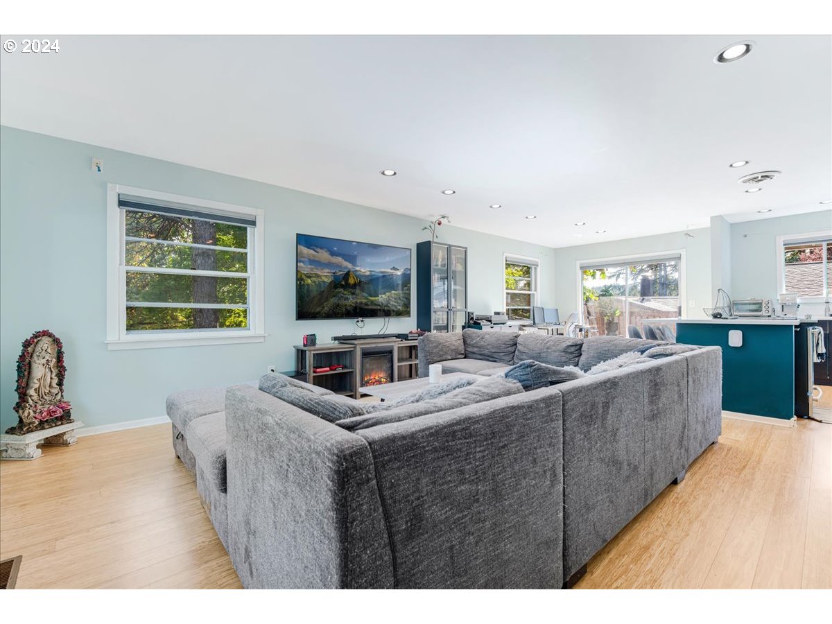 2675 Southwest Spring Garden Street Portland, OR 97219 - Photo 9 of 31 a living room with furniture and a flat screen tv