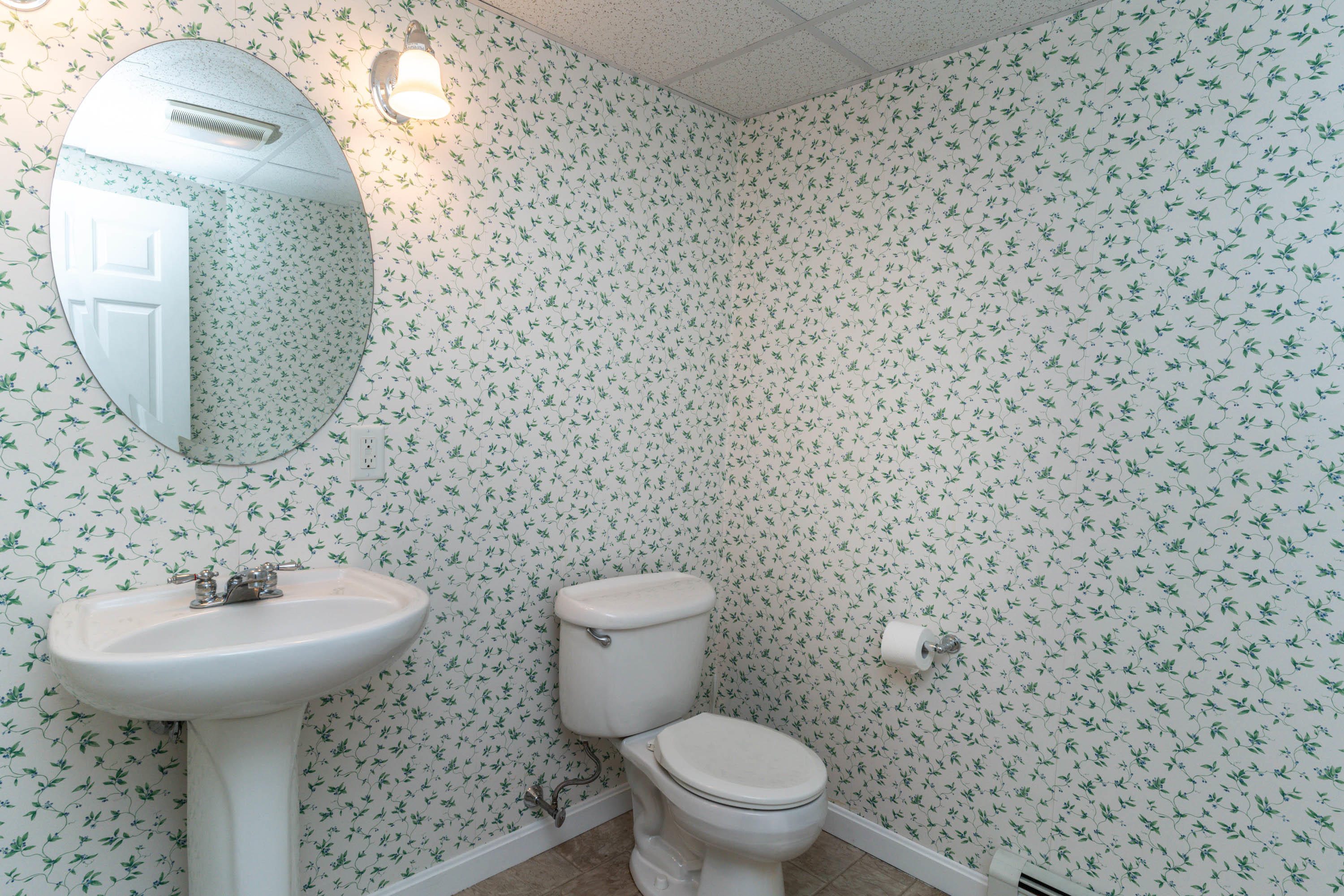 102 Long Hill Road Dennis, MA 02638 - Photo 20 of 24 a bathroom with a sink a toilet and mirror