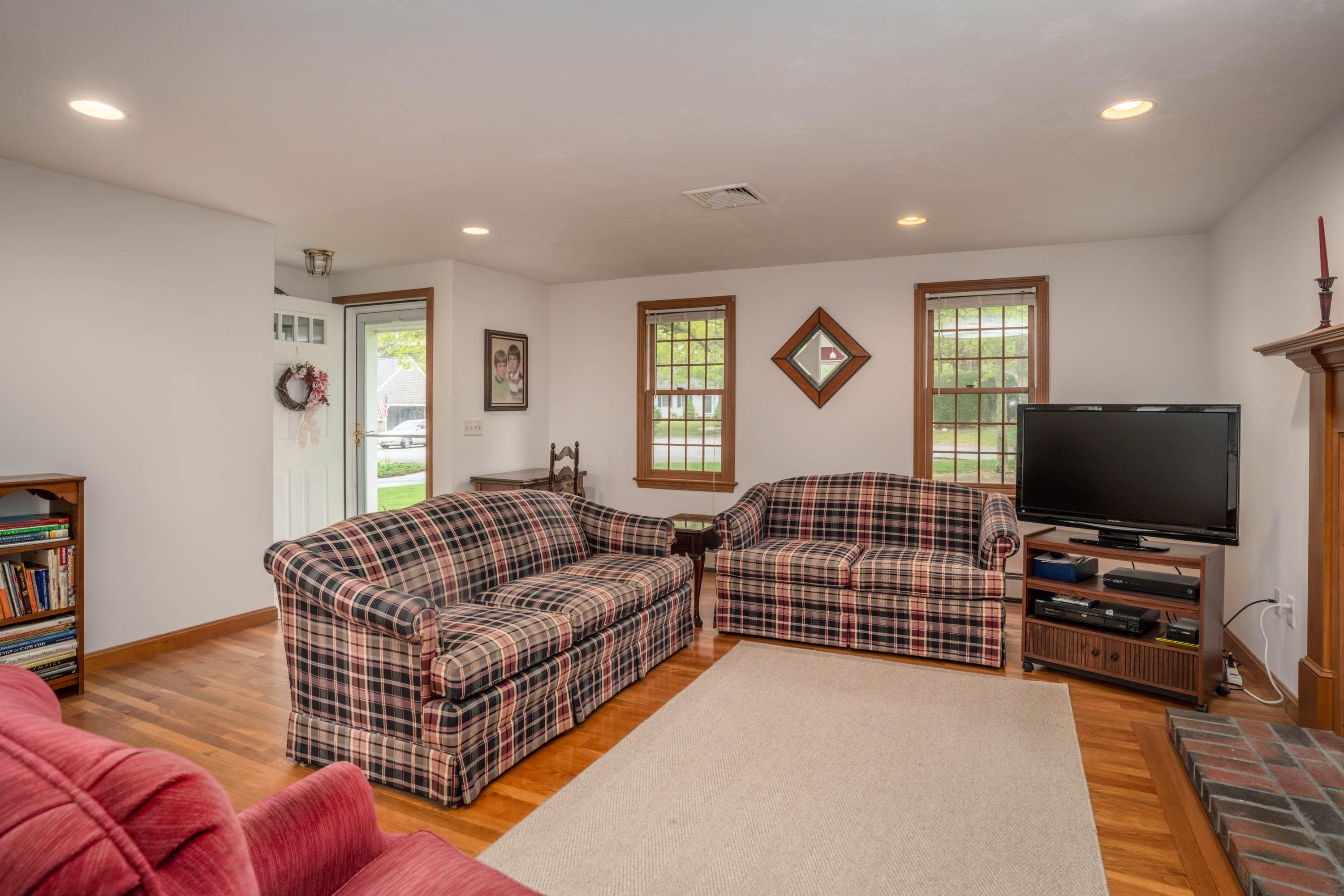102 Long Hill Road Dennis, MA 02638 - Photo 3 of 24 a living room with furniture and a flat screen tv