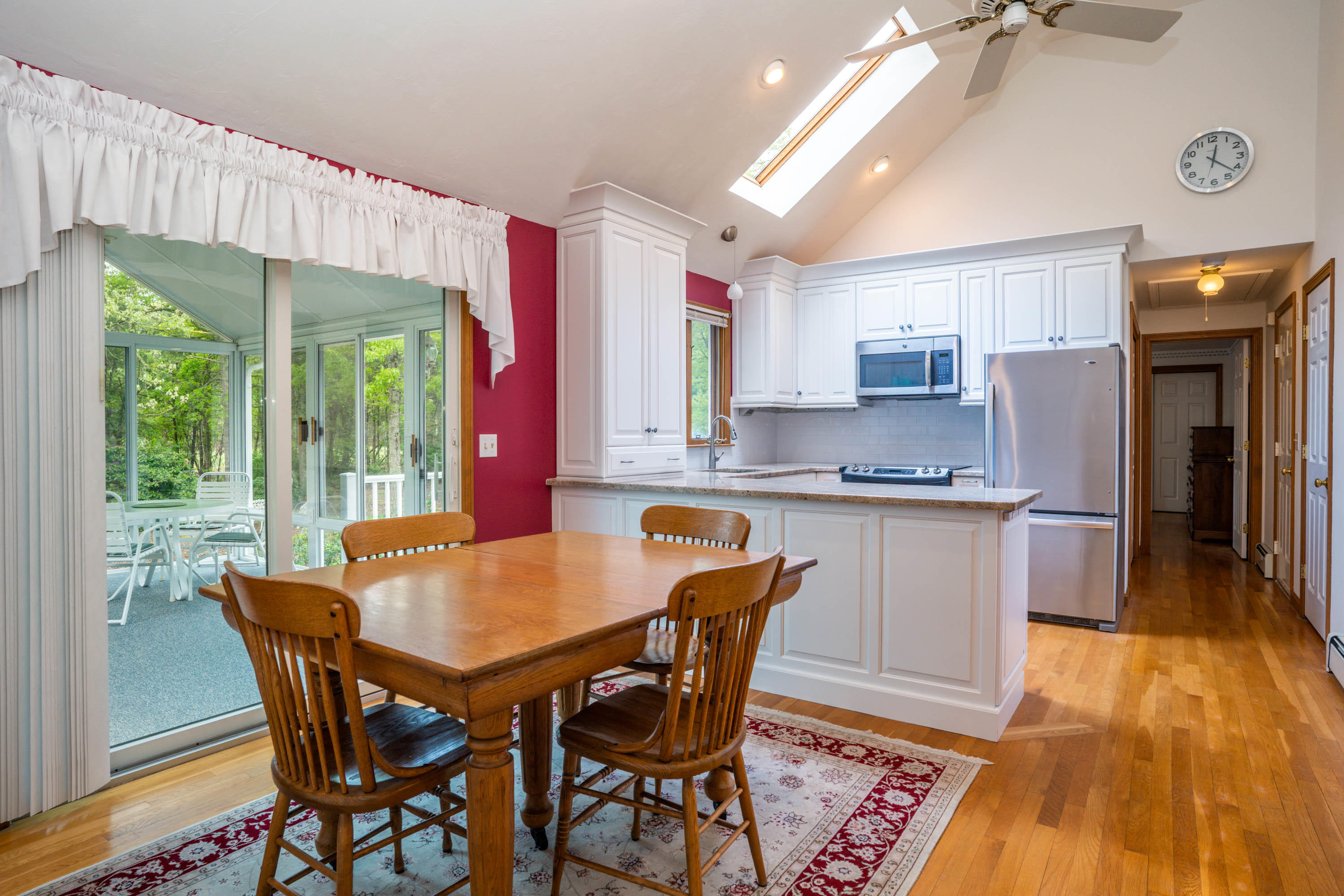 102 Long Hill Road Dennis, MA 02638 - Photo 6 of 24 a kitchen with stainless steel appliances granite countertop a kitchen island hardwood floor and a sink
