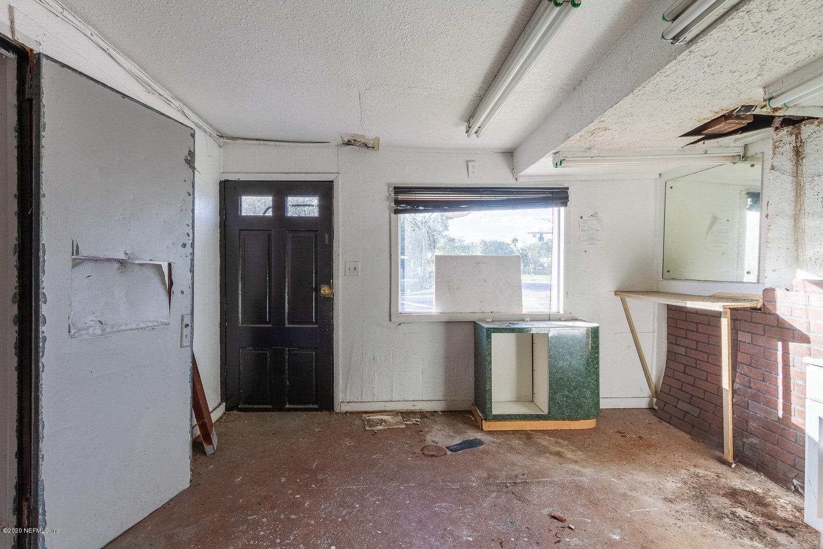 2905 Moncrief Road Jacksonville, FL 32209 - Photo 23 of 82 an empty room with closet and windows