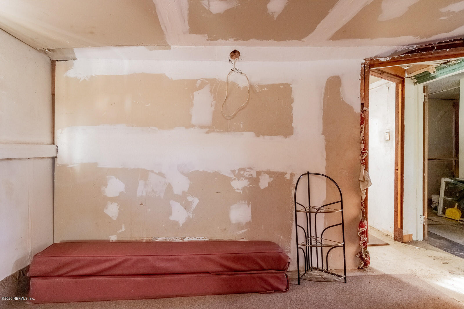 2905 Moncrief Road Jacksonville, FL 32209 - Photo 66 of 82 a bedroom with a bed and a painting on the wall