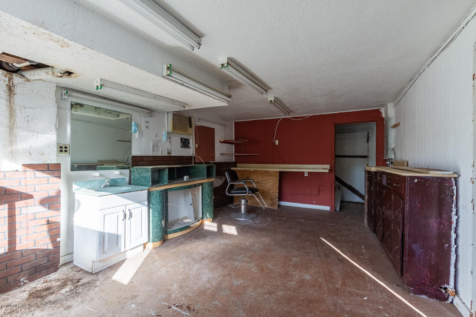 2905 Moncrief Road Jacksonville, FL 32209 - Photo 8 of 82 a room with wooden cabinets and furniture