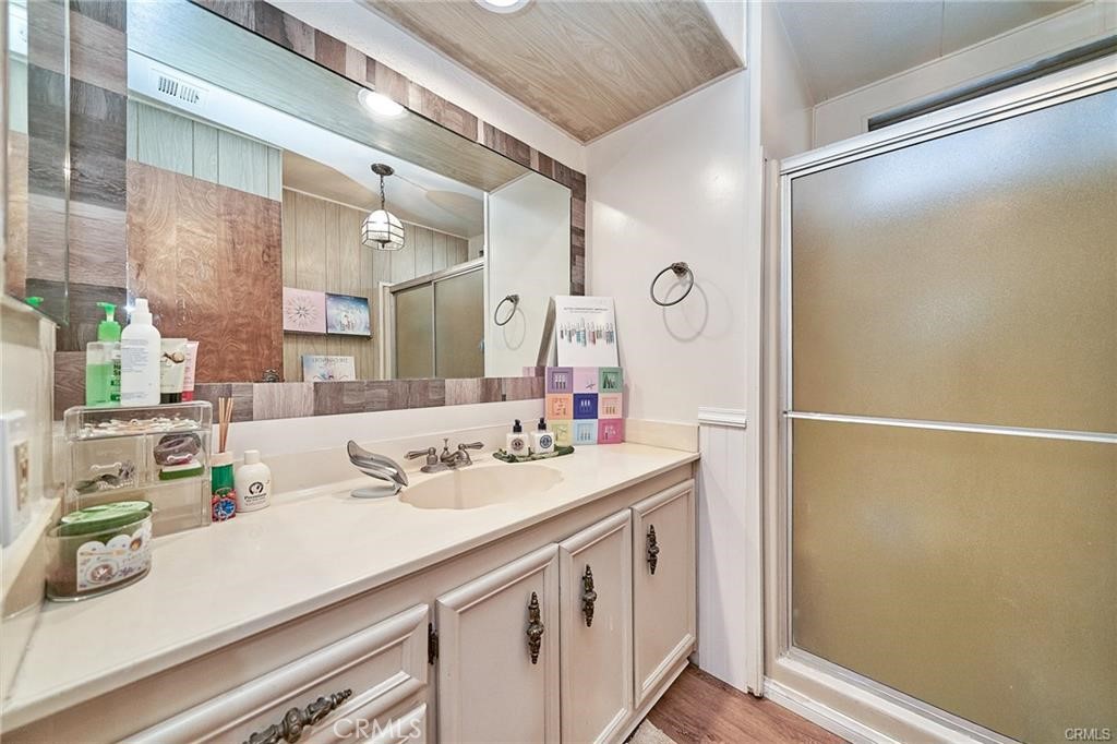 2601 East Victoria Street, Unit 394 Rancho Dominguez, CA 90220 - Photo 13 of 19 a bathroom with a sink and a mirror