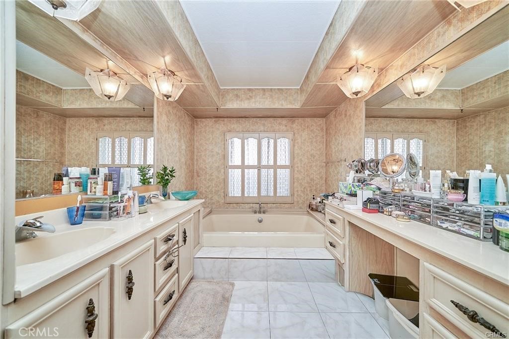 2601 East Victoria Street, Unit 394 Compton, CA 90220 - Photo 19 of 25 a large white kitchen with a large window and sink
