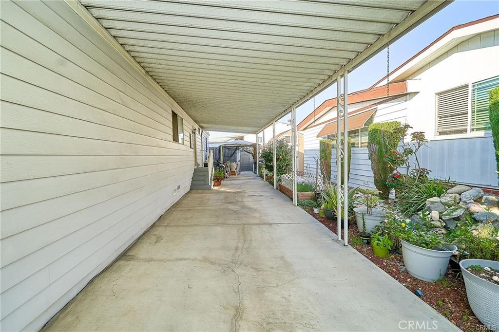 2601 East Victoria Street, Unit 394 Rancho Dominguez, CA 90220 - Photo 2 of 19 a porch with seating space
