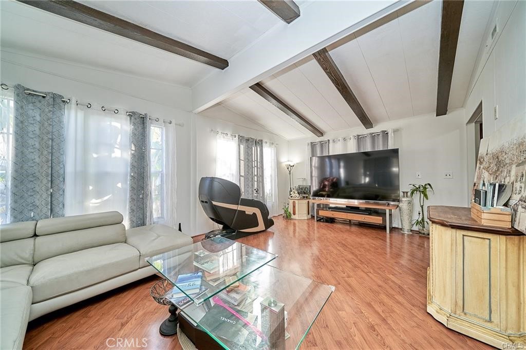 2601 East Victoria Street, Unit 394 Compton, CA 90220 - Photo 4 of 25 a living room with furniture and a flat screen tv