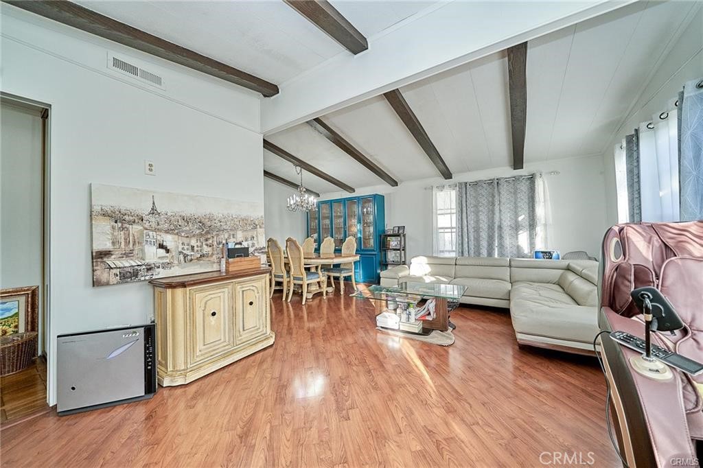 2601 East Victoria Street, Unit 394 Compton, CA 90220 - Photo 6 of 25 a living room with furniture and wooden floor