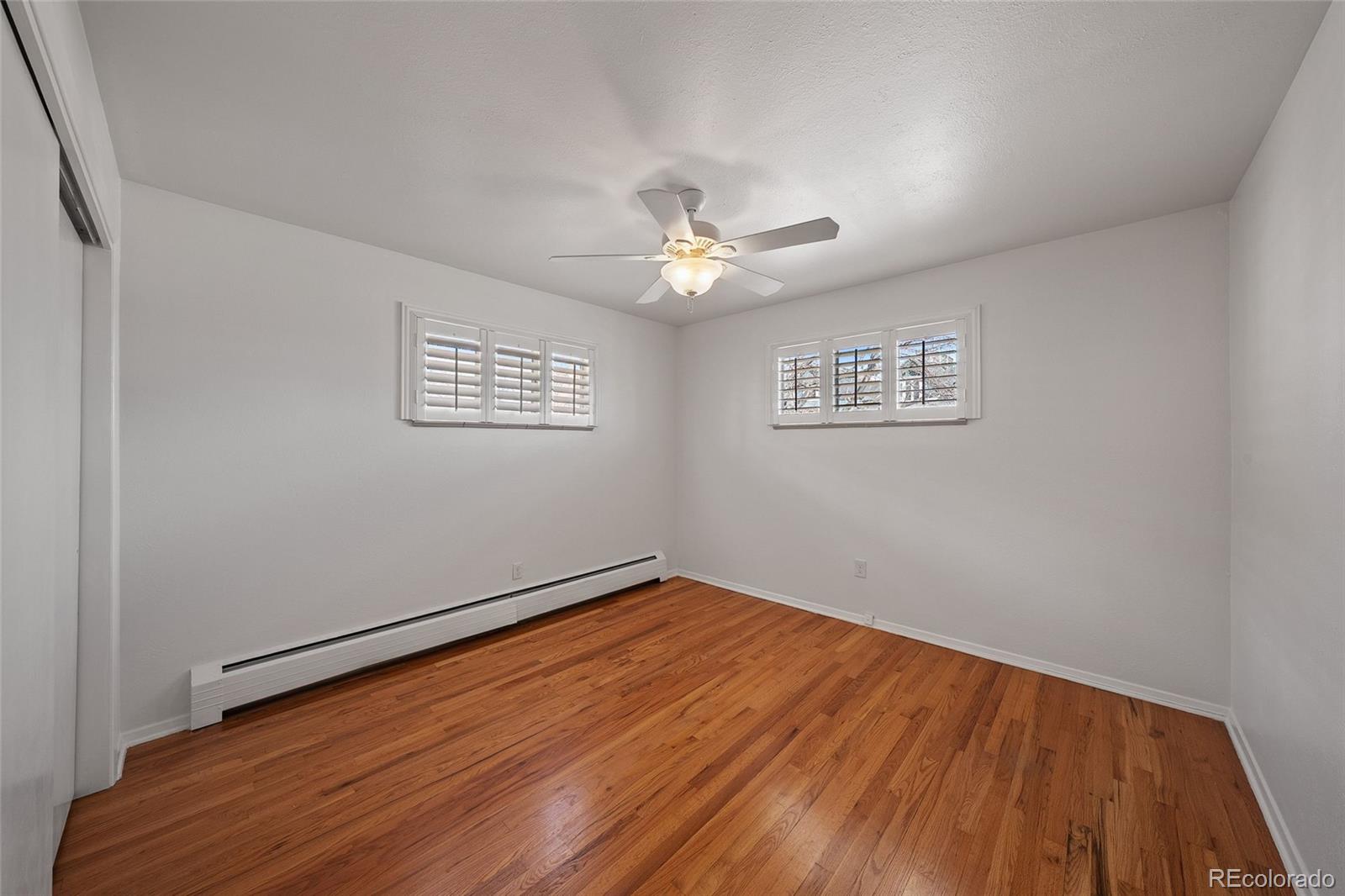 3045 Stuart Street Denver, CO 80212 - Photo 14 of 41 wooden floor in an empty room with a window