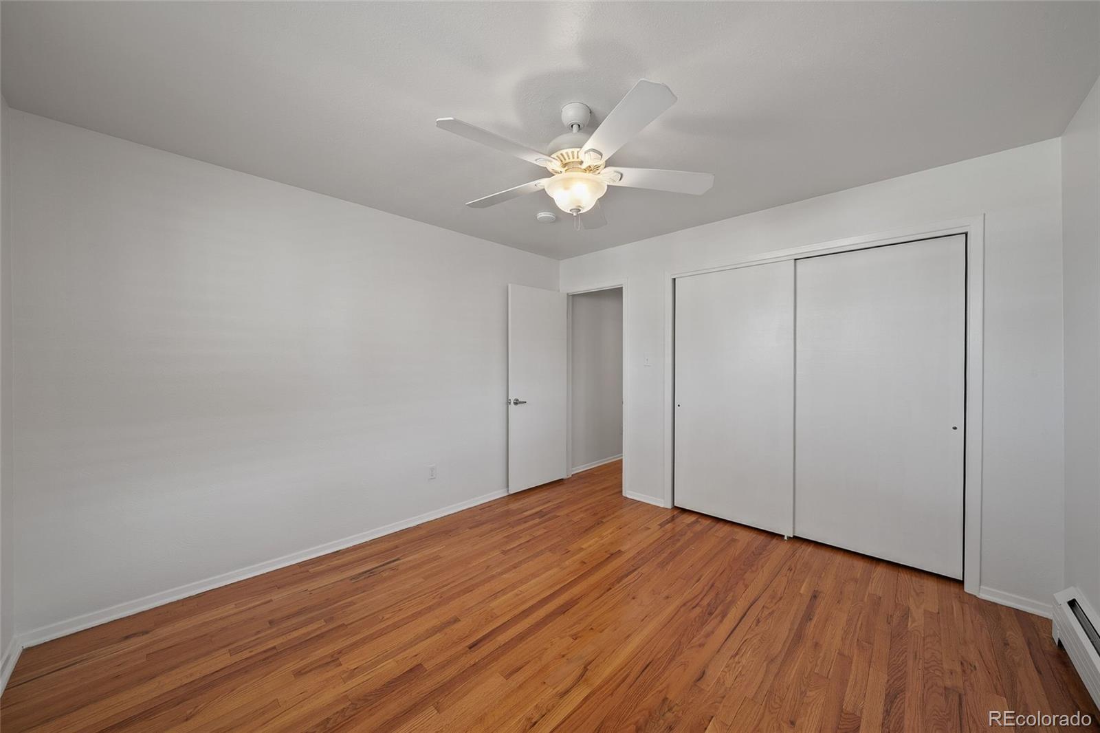 3045 Stuart Street Denver, CO 80212 - Photo 15 of 41 a view of an empty room with wooden floor