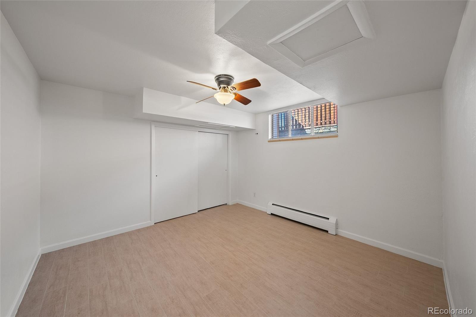3045 Stuart Street Denver, CO 80212 - Photo 24 of 41 an empty room with closet and fan