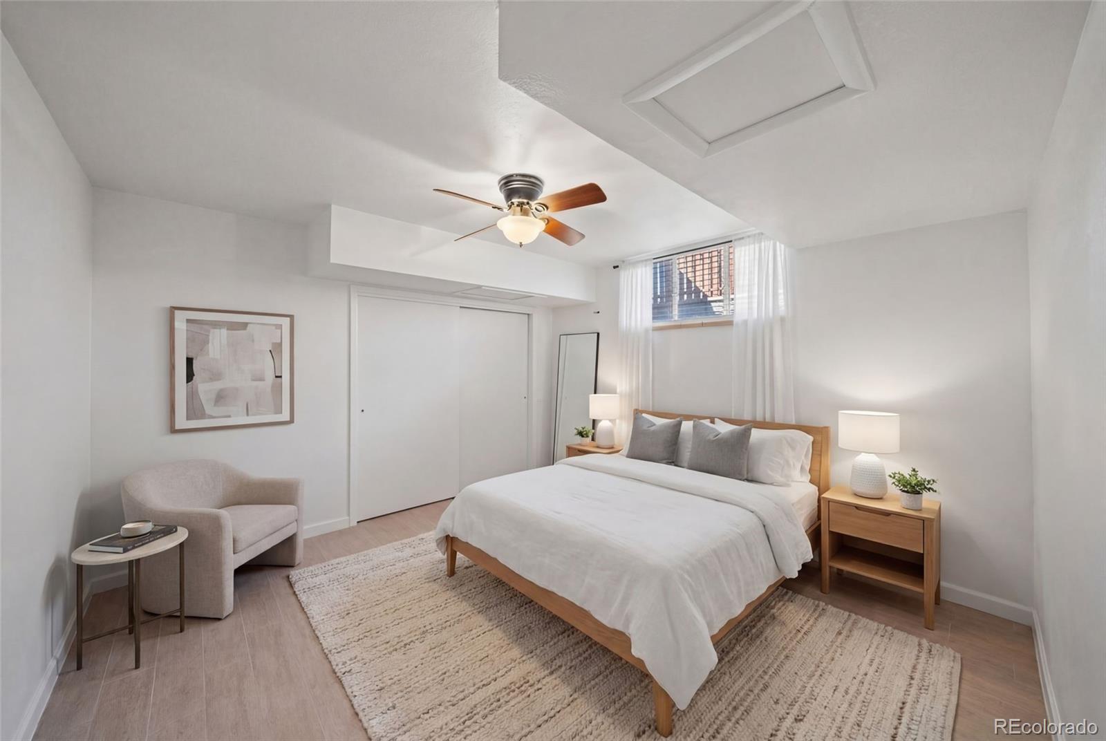 3045 Stuart Street Denver, CO 80212 - Photo 25 of 41 a bedroom with a bed and a chandelier