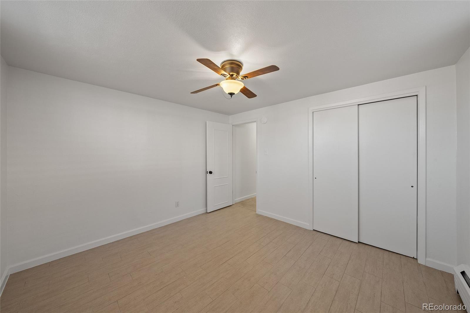 3045 Stuart Street Denver, CO 80212 - Photo 30 of 41 an empty room with a window and a ceiling fan