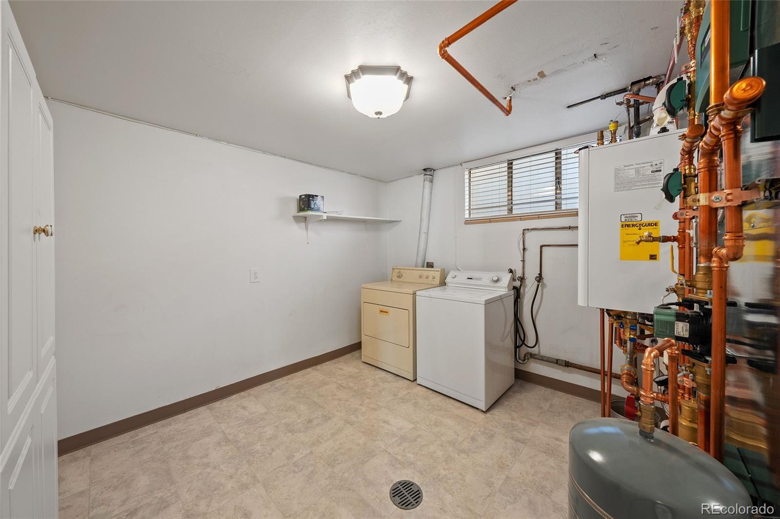 3045 Stuart Street Denver, CO 80212 - Photo 35 of 41 a utility room with dryer and washer