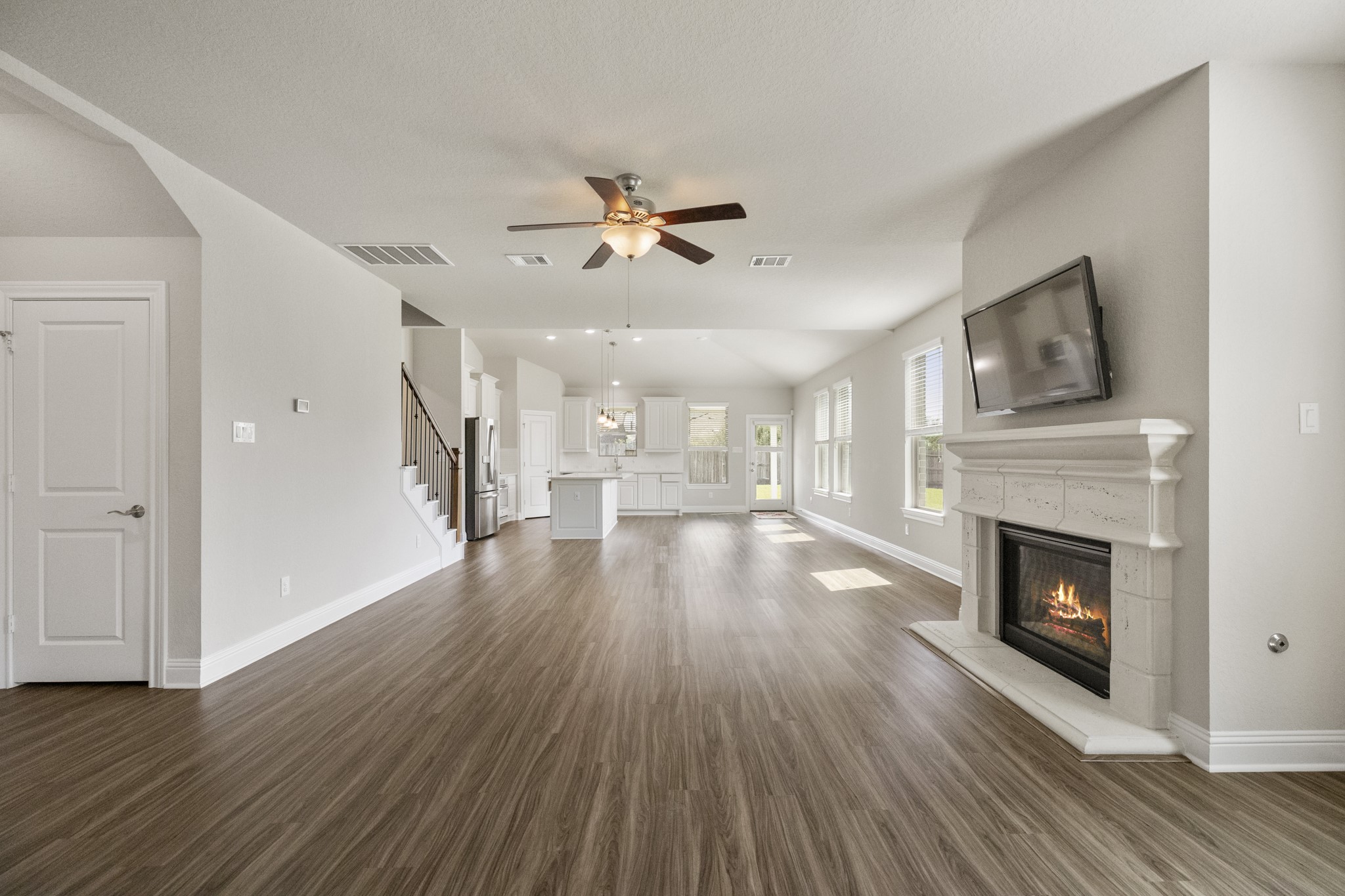 7502 Windsor Park Court Spring, TX 77379 - Photo 9 of 50 a view of a livingroom with wooden floor and a fireplace