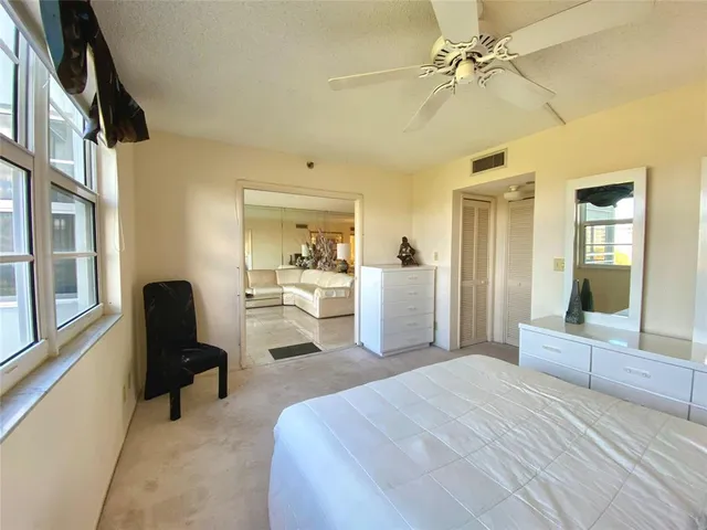 a bedroom with a bed and furniture