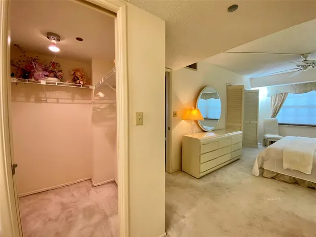 a view of a bedroom with a bed and couch