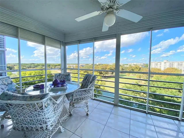 a view of a city from a dining room with furniture window and outside view