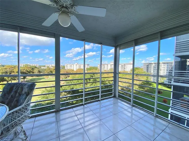 a view of a room with window and furniture