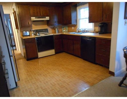 149 Standish Road Bourne, MA 02562 - Photo 8 of 14 a kitchen with stainless steel appliances granite countertop a stove a refrigerator and a sink