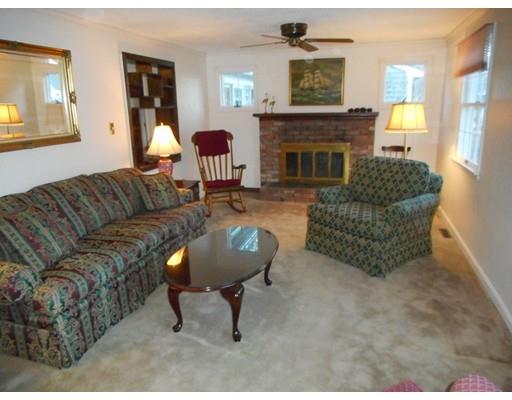 149 Standish Road Bourne, MA 02562 - Photo 9 of 14 a living room with furniture and a fireplace