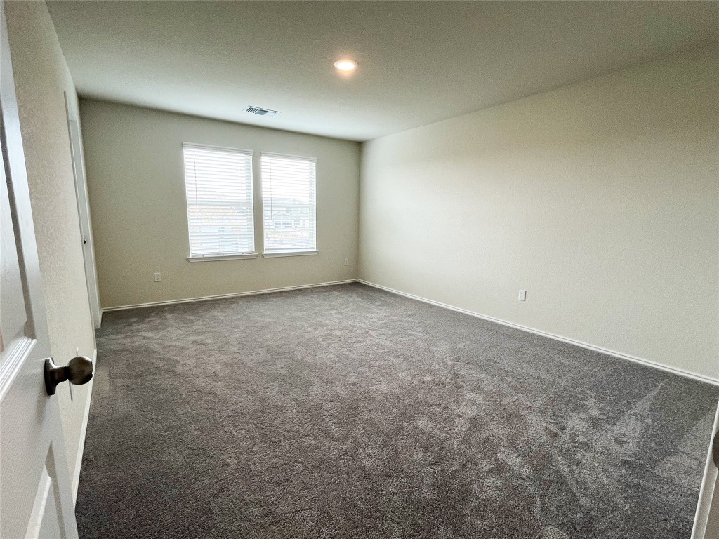 54 Pacific Loon Street Leander, TX 78641 - Photo 12 of 27 an empty room with a window