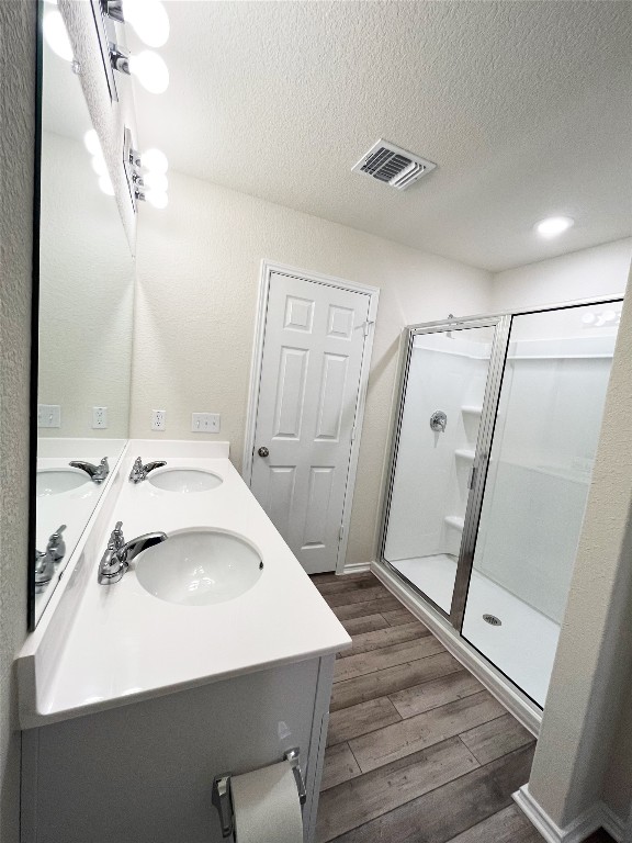 54 Pacific Loon Street Leander, TX 78641 - Photo 14 of 27 a bathroom with a sink and mirror