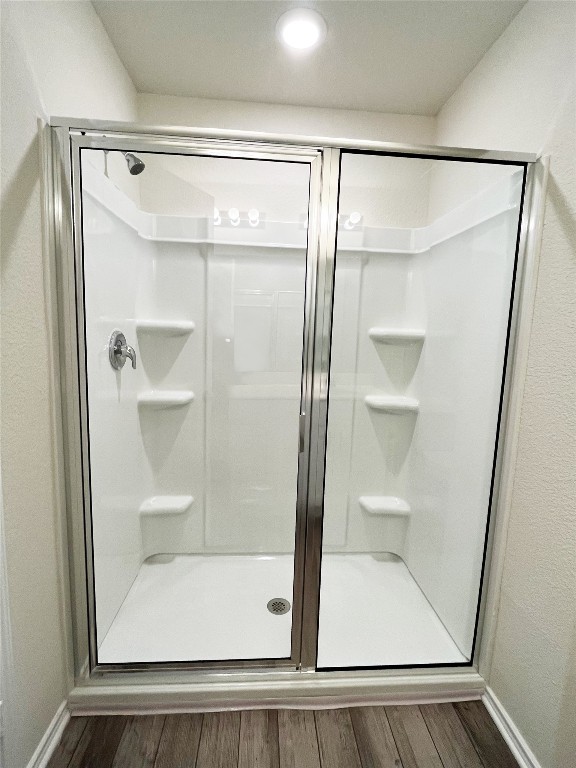 54 Pacific Loon Street Leander, TX 78641 - Photo 15 of 27 a bathroom with a glass shower door