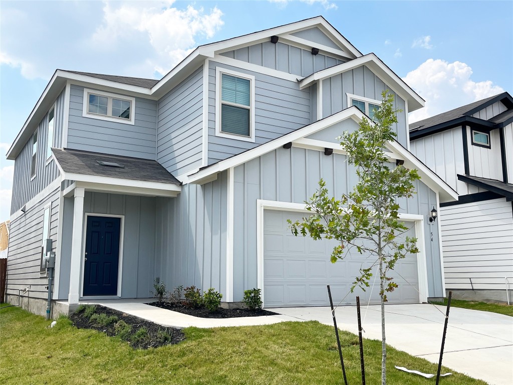 54 Pacific Loon Street Leander, TX 78641 - Photo 2 of 27 a front view of a house with garden