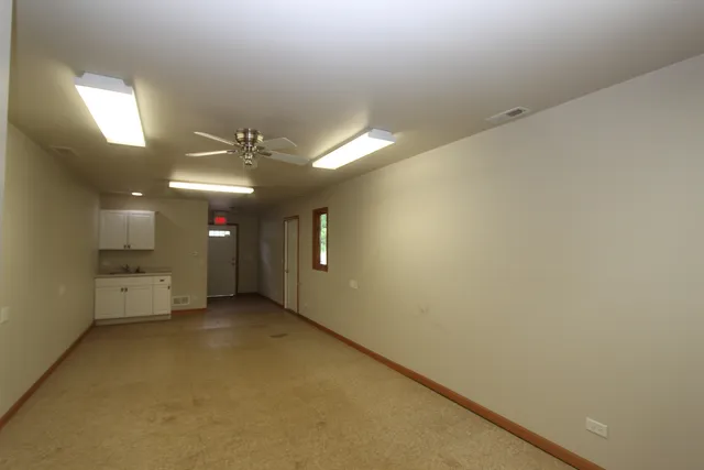 a view of a livingroom and a hallway