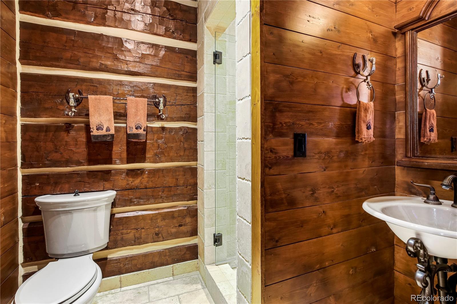 1334 South Grapevine Road Golden, CO 80401 - Photo 20 of 36 a bathroom with a toilet and a shower