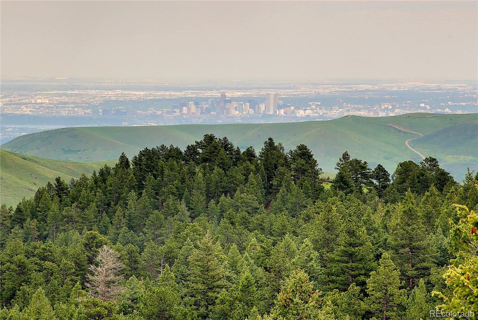 1334 South Grapevine Road Golden, CO 80401 - Photo 8 of 36 an aerial view of a houses with a lake view