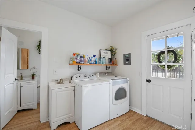 a utility room with closet dryer and washer