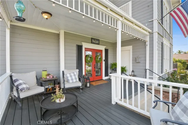 a view of a dining table and chairs in the balcony