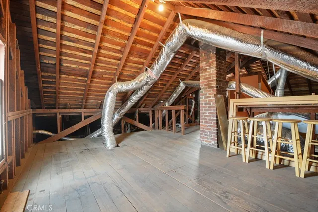 a view of a livingroom with furniture and wooden floor
