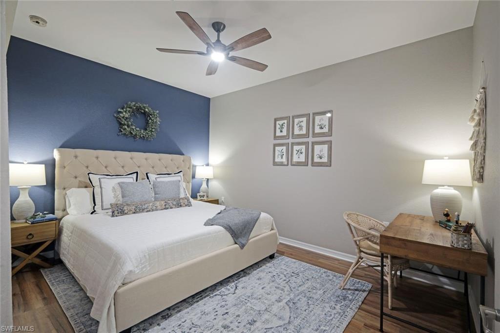 10329 Heritage Bay Boulevard, Unit 1641 Naples, FL 34120 - Photo 15 of 22 Bedroom with wood finished floors, baseboards, and a ceiling fan