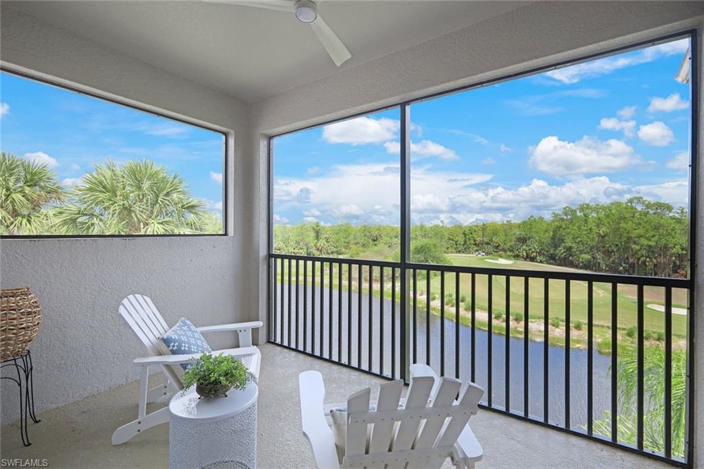 10329 Heritage Bay Boulevard, Unit 1641 Naples, FL 34120 - Photo 20 of 22 Sunroom / solarium featuring a textured wall and healthy amount of natural light
