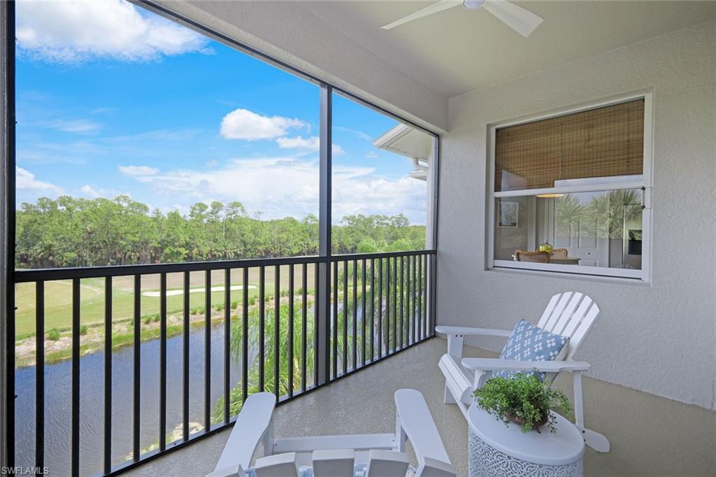 10329 Heritage Bay Boulevard, Unit 1641 Naples, FL 34120 - Photo 21 of 22 Balcony with ceiling fan and a water view