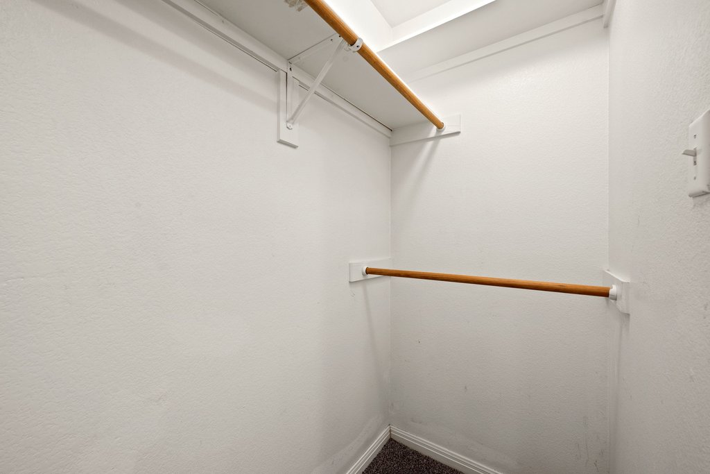 5208 Sioux Lane Austin, TX 78734 - Photo 29 of 35 An organized closet featuring two levels of hanging rods for ample storage.