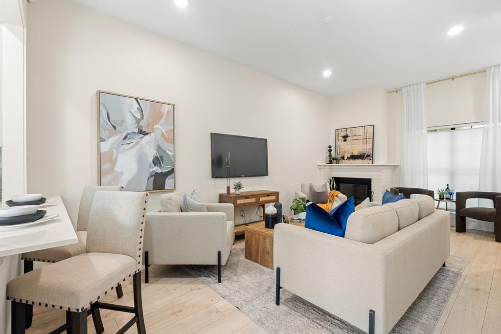 2806 Knight Street, Unit 103 Dallas, TX 75219 - Photo 3 of 17 a living room with furniture and a flat screen tv