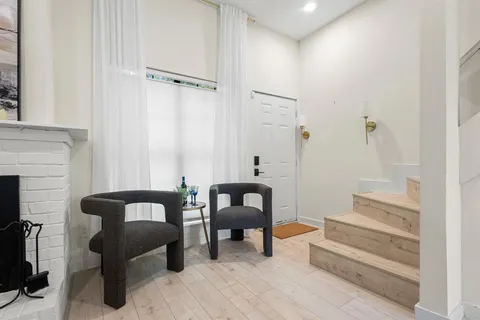 a view of a livingroom with furniture and a couch