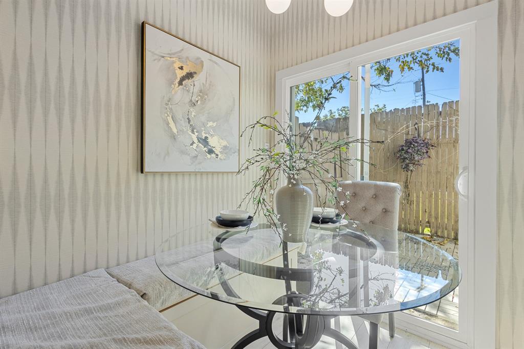 2806 Knight Street, Unit 103 Dallas, TX 75219 - Photo 8 of 17 a dining room with furniture and wooden floor
