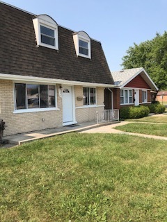 5204 State Road Burbank, IL 60459 - Photo 2 of 30 a front view of a house with a yard
