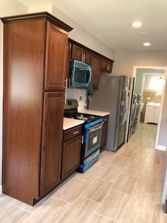 5204 State Road Burbank, IL 60459 - Photo 24 of 30 a kitchen with stainless steel appliances a refrigerator and a stove