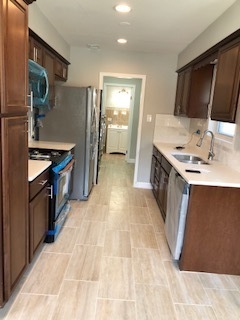 5204 State Road Burbank, IL 60459 - Photo 25 of 30 a kitchen that has a sink and a stove
