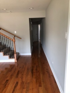 5204 State Road Burbank, IL 60459 - Photo 4 of 30 a view of a hallway with wooden floor and stairs